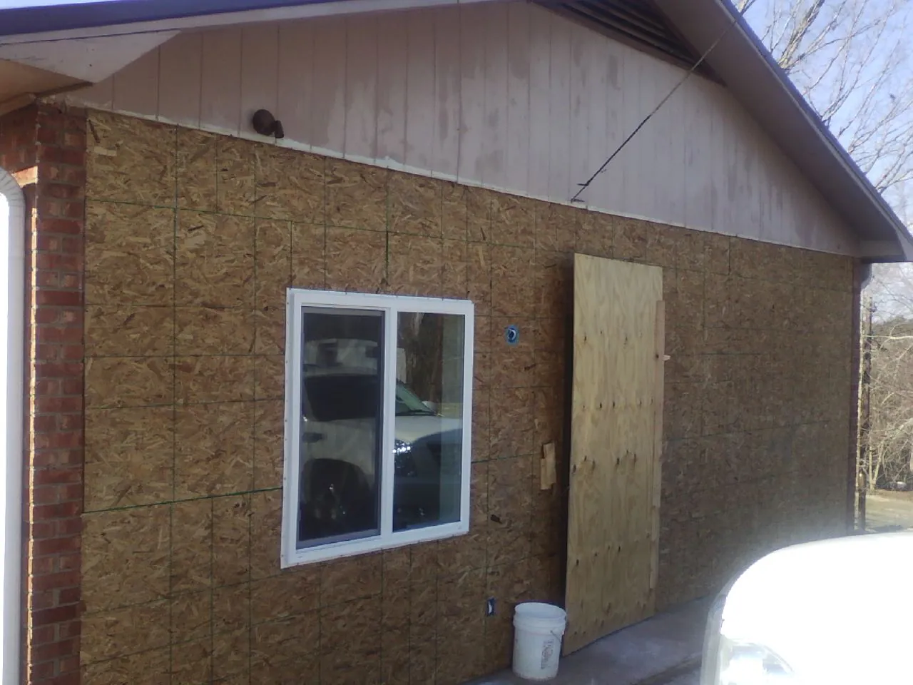 OSB sheathing on a garage addition wall before siding in Maxatawny